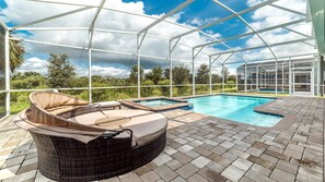 Breathtaking scenery of the pool and spa surrounded by lush greenery, creating a tranquil and picturesque setting