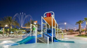 Kids' splash zone adventure—fun water play under the stars!