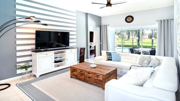 Spacious living room area with cozy sofa, perfect for family reunion