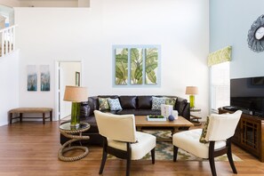 Living Room: Spacious and inviting, the area features a cozy sofa, perfect for a family reunion, providing comfort and a warm atmosphere.