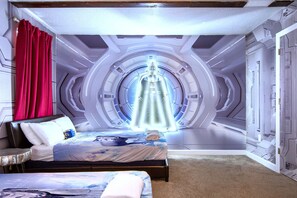 Galactic-themed bedroom with stunning wall art and cozy twin beds for kids.
