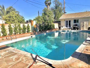 Pool view with guesthouse in back and bbque
