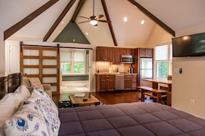 Full view of the spacious and well-appointed studio. Beautiful vaulted ceilings