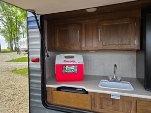 Medium Playmate cooler in the outside kitchenette