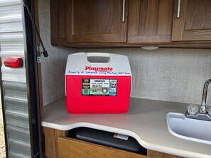 Medium Playmate cooler in the outside kitchenette