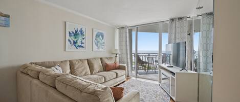 The ocean front living room is well-appointed with comfortable furnishings.