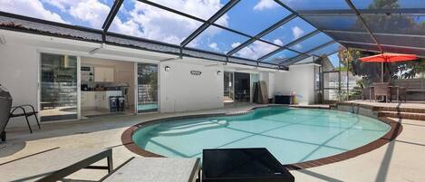 Pool area with entrances to the kitchen and living area