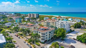 Ariel view of entire building with the Gulf in the background.