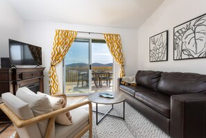 Living room features a queen sleeper sofa