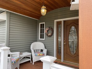 Cozy front porch to drink your morning coffee or enjoy a quiet evening. 