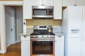 Cook a delicious meal with ease using the fully stocked kitchen, perfect for morning coffee or a cozy dinner in.