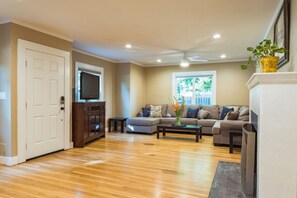 Feel at home in this welcoming space, ideal for relaxing by the fireplace or cozying up on the couch.