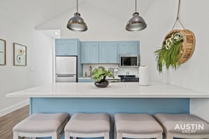 Kitchen with large island and bar seating