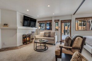 Living room with wood-burning fireplace