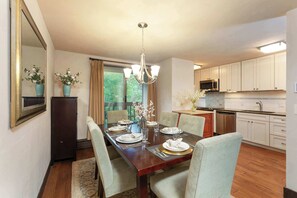 Open dining/ kitchen area with seating for six