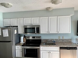 Granite Countertops and Stocked Kitchen
