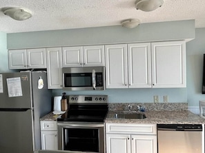 Granite Countertops and Stocked Kitchen
