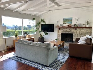 Living Room with real fireplace and mountain views.