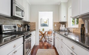 Kitchen with small indoor dining area (seats 4 comfortably)
