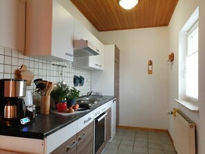 Cabinetry, Countertop, Property, Kitchen Appliance, Window, Kitchen Stove, Kitchen, Interior Design, Wood, Lighting
