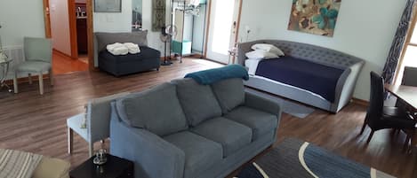 Room view with sofa sleeper and daybed with trundle