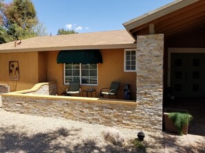 Front porch for outdoor seating in front of home..