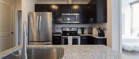 on the kitchen counter all sorts of appliances smoothie blender etc.