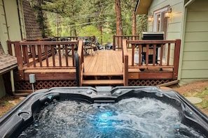 Relax in the hot tub with mountain views after a long day's adventure!