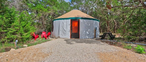 Front view of the yurt and outdoor seating