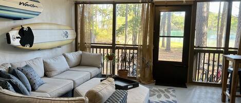 Screen porch with view of woods & wildlife.