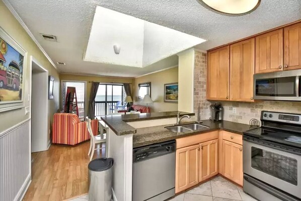 Renovated kitchen complete with appliances, cookware & dishes for your vacation.