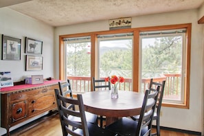 The dining table overlooks the lake.