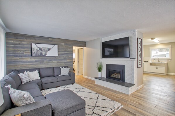 Main Livingroom- Located on the main floor, Smart TV, and Gas fireplace. 