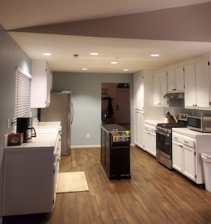 Kitchen with Island and Large Stainless Steel Appliances 