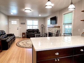 View from Kitchen overlooking the spacious Living area with gas fireplace
