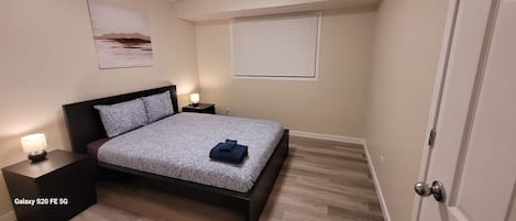 The master bedroom with a queen bed on the main floor.