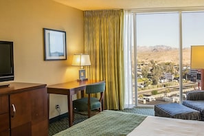 Spacious master-bedroom with a King size bed and flat screen TV. Exact unit will be assigned upon arrival. Views, colors and decor may vary.