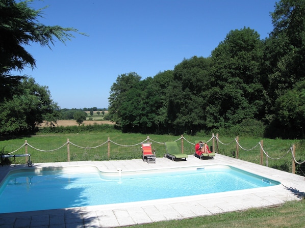 The pool is set in a quet spot overlooking meadows