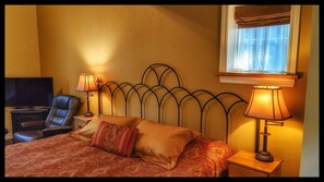 King bed with locally crafted wrought iron headboard
