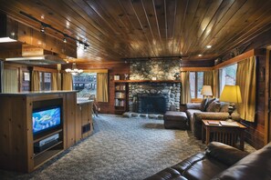 Living room with fireplace. Firewood provided in season.