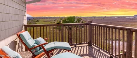 Stunning sunset views over the private backyard and marsh.