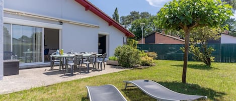 Plant, Sky, Property, Cloud, Building, Shade, Window, Outdoor Furniture, Architecture, Tree