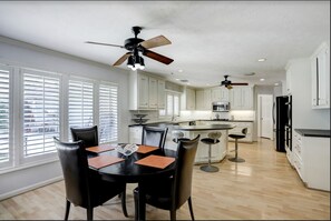 Spatious, open kitchen with microwave, lots of seating and counter space.