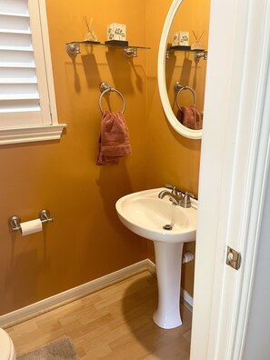 Half-bath off of kitchen near back entry.