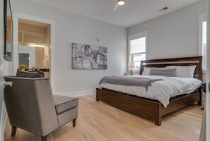 Relax in this inviting king bedroom, where simplicity meets comfort. 