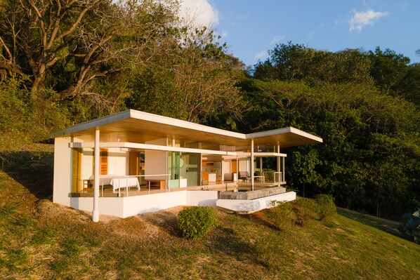 Our small hillside villa overlooks the ocean/beach, perfect for tow people