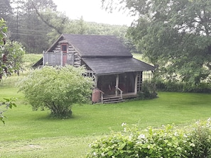 Peaceful, quiet, secluded.  Park under the tree, in front of the Cabin.