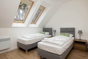 Bedroom with two comfortable single beds.