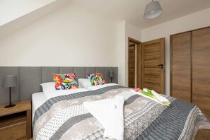 Comfortable bedroom with a double bed and closet.