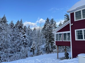 There is a great 3 season room off the back of the home overlooking the brook